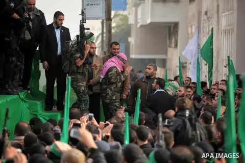Abu Obaida, the spokesman for the Ezzedine Al-Qassam Brigades, Hamas's armed wing, attends during rally marking the 27th anniversary of Hamas' founding, in Gaza City December 14, 2014. Photo by Ashraf Amra