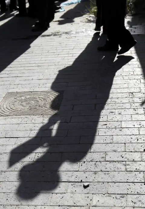Relatives of three Israeli suspects, members of the right-wing Lehava organisation, wait during a hearing outside the District Court in Jerusalem on December 15, 2014. The three are suspects behind an arson attack last m...
