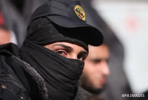 Palestinian Islamic Jihad movement supporters take part in a rally to show solidarity with prisoners held in Israeli jails, in front of Red cross office, in Gaza city December 16, 2014. Photo by Ashraf Amra