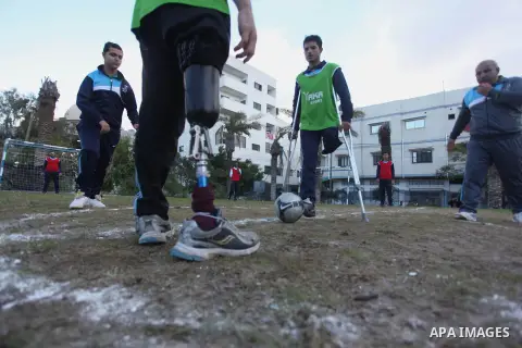 Palestinians disabled participate in an athletics championship for disabled, at Al-Jazeera Club in Gaza city on December 20, 2014. Photo by Ashraf Amra