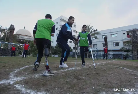 Palestinians disabled participate in an athletics championship for disabled, at Al-Jazeera Club in Gaza city on December 20, 2014. Photo by Ashraf Amra