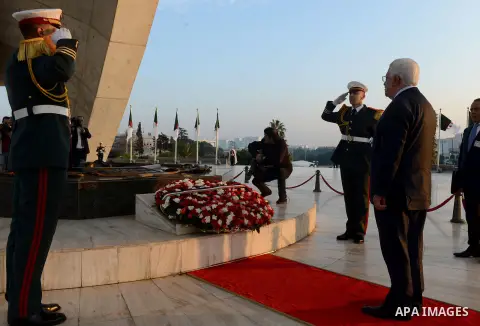 Palestinian President Mahmoud Abbas lays a wreath at the tomb of the Unknown Soldier, in Algeria on December 21, 2014. Abbas is on a three-day official visit and he is expected to meet several officials. Photo by Thaer G...