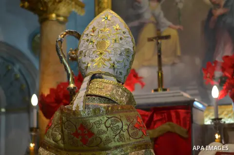 Armenian Catholic Bishop of Alexandria, Krikor Augustine Kusa, attends an annual Christmas celebration, at Boutrerreqih Abdeen, in cairo, Egypt, on December 25, 2014. Photo by Amr Sayed