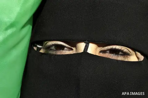A Palestinian woman takes part in a protest calling for end the Israeli illegal blockade on Gaza Strip and against the slow rehabilitation of the strip after damage incurred during the recent Israeli offensive on Gaza St...