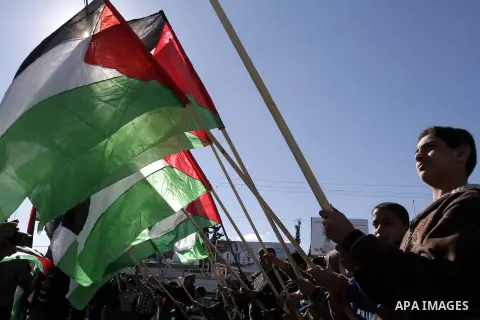 Palestinians take part in a protest calling for end the Israeli illegal blockade on Gaza Strip and against the slow rehabilitation of the strip after damage incurred during the recent Israeli offensive on Gaza Strip, in...