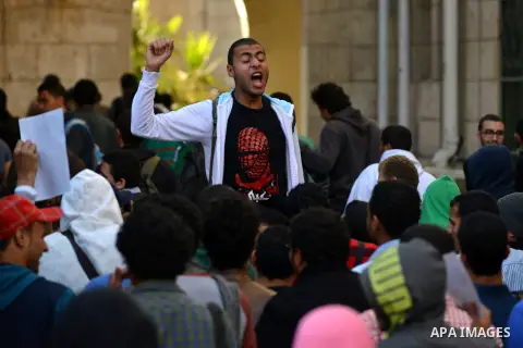 Egyptian supporters of Muslim Brotherhood who belonged to "Students against Coup" movement participate in a demonstration to demand the release of their detained colleagues, outside the Cairo University, Cairo December 2...