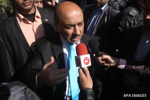 Palestinian housing minister Mufeed al-Hasayna, speaks during a protest to demanding their salaries, in front of the headquarters of the Council of Ministers in Gaza city, on December 30, 2014. Photo by Mohammed Asad