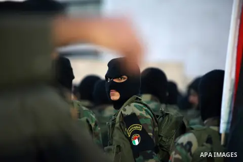 Palestinian Fatah movement fighters parade during a rally marking the 50th anniversary of the founding of the Fatah movement, in the West Bank city of Ramallah December 31, 2014. Abbas signed on to 20 international agree...