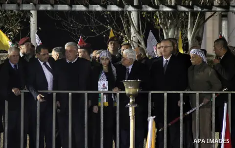 Palestinian President Mahmoud Abbas gestures during a rally marking the 50th anniversary of the founding of the Fatah movement, in the West Bank city of Ramallah December 31, 2014. Abbas signed on to 20 international agr...