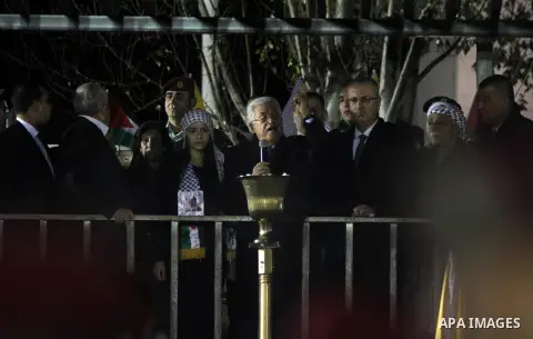 Palestinian President Mahmoud Abbas gestures during a rally marking the 50th anniversary of the founding of the Fatah movement, in the West Bank city of Ramallah December 31, 2014. Abbas signed on to 20 international agr...