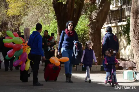 Egyptians enjoy at a zoo in a holiday commemorating the birth of Prophet Mohammed, known in Arabic as "Mawlid al-Nabawi", Cairo, Egypt 03 January 2015. Muslims around the world are celebrating the Prophet's birthday, whi...