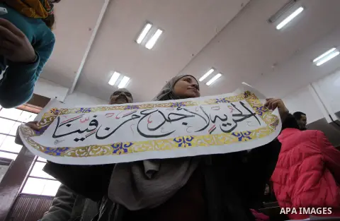 Relatives and friends attend the retrial of Alaa Abdel Fattah and 24 others, in the courtroom in Cairo on January 17, 2015. The defendants were sentenced in June to 15 years in prison for holding an unlicensed and violen...