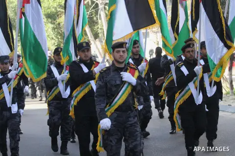 Palestinian members of the National Security forces march during a military parade to mark the anniversary of late the former interior minister, Said Siyam, in Gaza City, January 18, 2015. Photo by Mohammed Asad