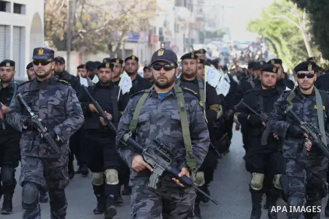 Palestinian members of the National Security forces march during a military parade to mark the anniversary of late the former interior minister, Said Siyam, in Gaza City, January 18, 2015. Photo by Mohammed Asad