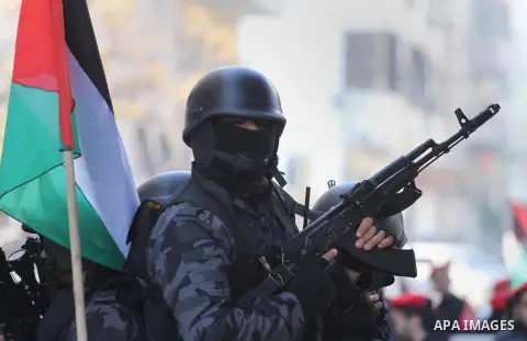 Palestinian members of the National Security forces march during a military parade to mark the anniversary of late the former interior minister, Said Siyam, in Gaza City, January 18, 2015. Photo by Mohammed Asad