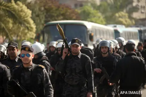 Members of Palestinian security forces loyal to Hamas take part in a parade marking the sixth anniversary of the death of former Hamas interior minister Saeed Seyam, in Gaza City January 18, 2015. Seyam was killed by an...
