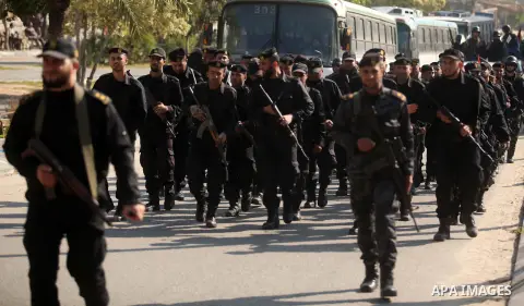 Members of Palestinian security forces loyal to Hamas take part in a parade marking the sixth anniversary of the death of former Hamas interior minister Saeed Seyam, in Gaza City January 18, 2015. Seyam was killed by an...
