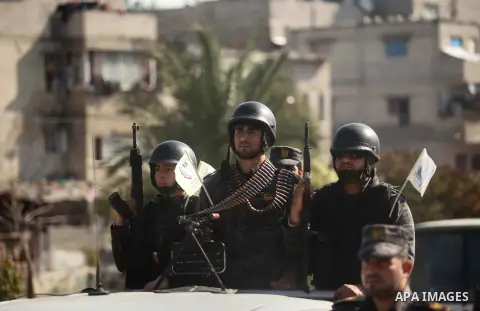 Members of Palestinian security forces loyal to Hamas take part in a parade marking the sixth anniversary of the death of former Hamas interior minister Saeed Seyam, in Gaza City January 18, 2015. Seyam was killed by an...