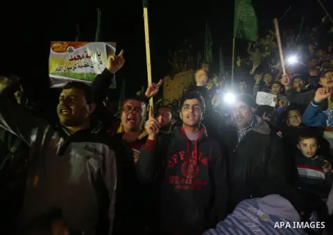 Palestinians take part in a protest against a cartoon of the Prophet Mohammed that was published by the French satirical magazine Charlie Hebdo in an edition issued a week after 12 people were killed by Islamist gunmen a...