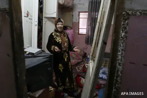 A Palestinian woman inspects the damages at her house after an Israeli military operation, at Balata refugee camp naer in the West Bank city of Nablus January 21, 2015. Israeli forces launched a major detention campaign...