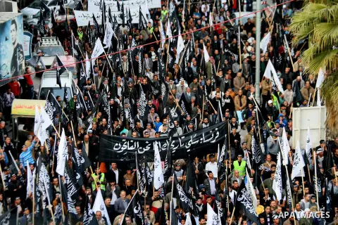 Palestinian supporters of the Islamists Tahrir Party (Liberation Party), take part during a rally in the West Bank city of Hebron, on January 24, 2015, against the printing of satirical sketches of the Prophet Mohammed b...