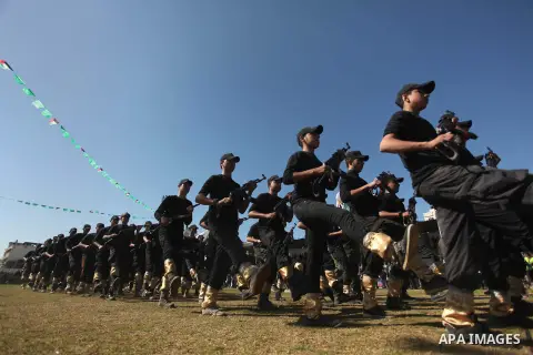 Palestinian youths demonstrate their skills during a graduation ceremony of a military-style camp organized by the Hamas movement in Gaza City on January 29, 2015. Hamas's armed wing organized "Liberation Youths Camps" f...