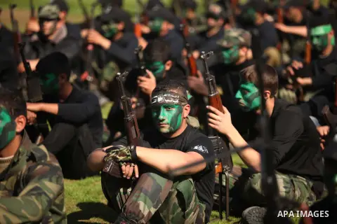 Palestinian youths demonstrate their skills during a graduation ceremony of a military-style camp organized by the Hamas movement in Gaza City on January 29, 2015. Hamas's armed wing organized "Liberation Youths Camps" f...