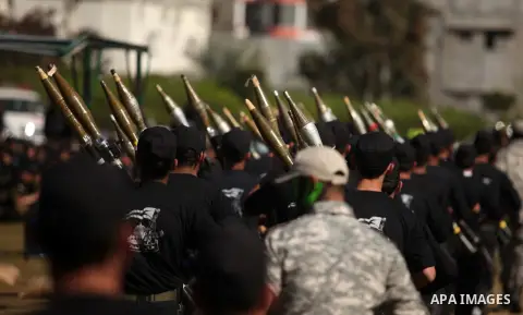 Palestinian youths demonstrate their skills during a graduation ceremony of a military-style camp organized by the Hamas movement in Gaza City on January 29, 2015. Hamas's armed wing organized "Liberation Youths Camps" f...
