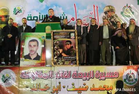 Palestinian supporters of Hamas movement shout slogans during a rally against the Egyptian court decision to list Ezz Eddin al-Qassam brigades as a ''terrorist group'', in Khan Younis in the southern Gaza Strip, February...