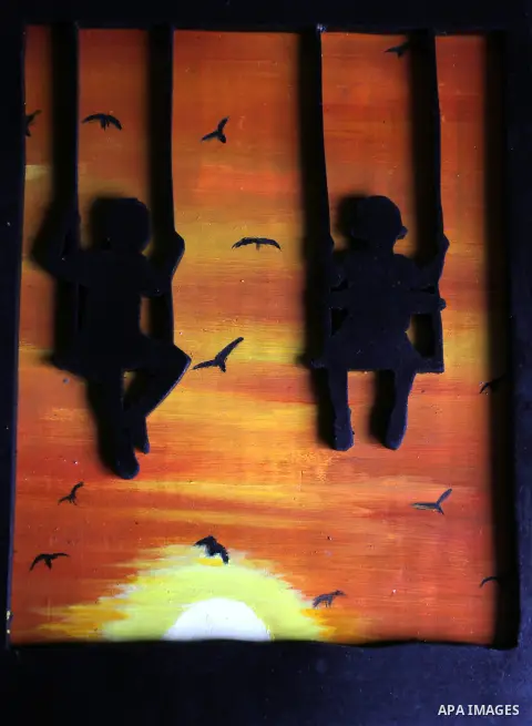 A painting is displayed at an atelier in Rafah in the southern Gaza Strip, February 9, 2015. Three Palestinian artists use the remains of houses which were destroyed during the 51 day Israeli recent war on Gaza Strip to...