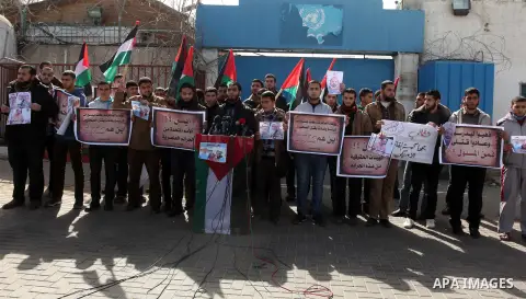 Palestinians take part in a protest against the murders of three Muslim students in Carolina, outside the UN headquarters in Gaza city on February 12, 2015. Craig Stephen Hicks, 46, has been charged with three counts of...