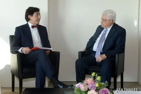 Palestinian President Mahmoud Abbas meets with Elio Di Rupo, president of the Socialist Party, in Brussels on February 12, 2015. Photo by Thaer Ganaim