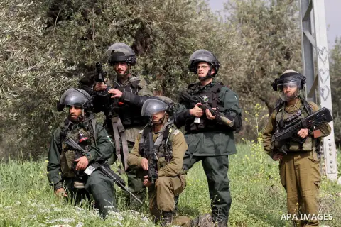 Israeli border policemen fire tear gas at Palestinian protesters during clashes following a protest against closure of the village road, in the West Bank village of Azzun near Qalqilya February 14, 2015. Photo by Nedal E...