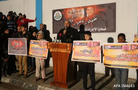 Palestinians take part during a protest to condemn Chapel Hill shooting victims, the three young Muslims who were gunned down in North Carolina this week, in Jabalia in Gaza City, February 14, 2015. Newlywed Deah Shaddy...