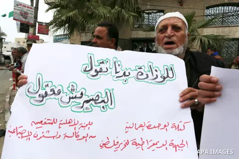 Palestinians with limited-income take part in a demonstration calling the Ministry of social affairs to pay their allocations and providing social assistance, in Rafah in the southern Gaza Strip, February 15, 2015. The P...