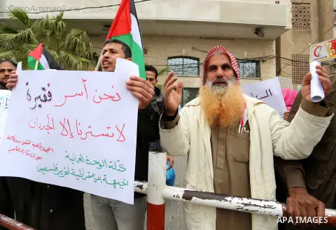 Palestinians with limited-income take part in a demonstration calling the Ministry of social affairs to pay their allocations and providing social assistance, in Rafah in the southern Gaza Strip, February 15, 2015. The P...