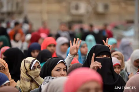 Egyptian students who are support ousted President Mohamed Morsi and the Muslim Brotherhood take part in a protest in Cairo University on February 15, 2015. Due to the escalation of students protest in the campus of seve...