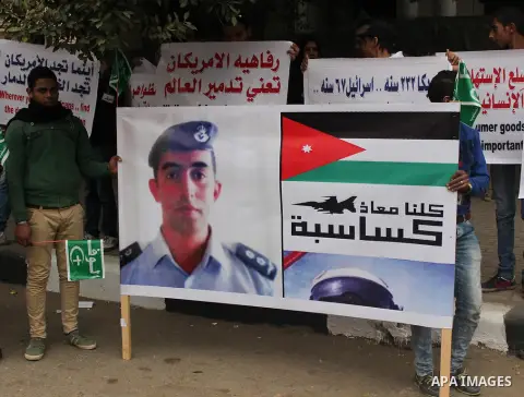 Egyptian supporters of the Wafd Party take part during a protest to show solidarity with the Jordanian pilot Muath al-Kasaesbeh, who was died by the hardline group, in front of American Embassy, in Cairo February 15, 201...