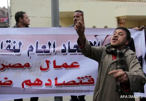 Egyptian protesters take part in a demonstration to denounce the killing of Egyptian Christians in Libya, outside the Coptic Cathedral of Saint Marcos, in Cairo, Egypt, 16 February 2015. An Islamic State video released o...