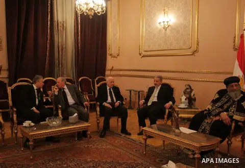 Egypt's Coptic Pope Tawadros II recieves condolences at Saint-Mark's Coptic Cathedral in Cairo's al-Abbassiya district on February 16, 2015, a day after the Islamic State (IS) group posted a video purportedly showing the...