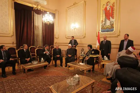 Egypt's Coptic Pope Tawadros II recieves condolences at Saint-Mark's Coptic Cathedral in Cairo's al-Abbassiya district on February 16, 2015, a day after the Islamic State (IS) group posted a video purportedly showing the...