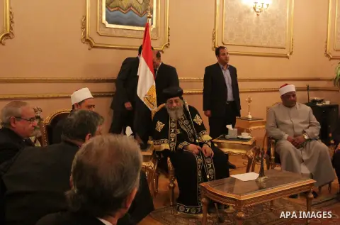 Egypt's Coptic Pope Tawadros II recieves condolences at Saint-Mark's Coptic Cathedral in Cairo's al-Abbassiya district on February 16, 2015, a day after the Islamic State (IS) group posted a video purportedly showing the...