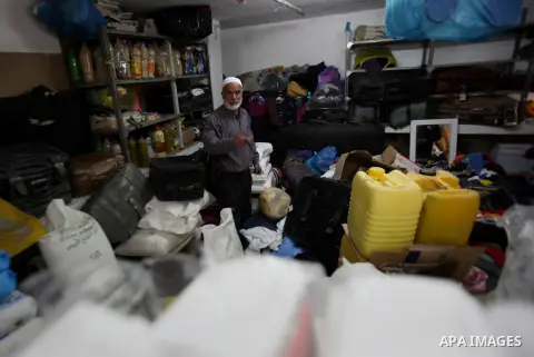 A Palestinian man inspects the damages at his house after an Israeli military operation, in the West Bank village of Yatma south of Nablus Feb. 18, 2015. Israeli troops stormed three Palestinian villages in Nablus distri...