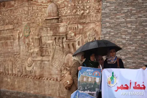 Palestinian employees of former Palestinian government take part a protest demanding their salaries to be paid, in front of the Legislative Council in Gaza city on February 18, 2015. Some 40,000 civil servants employed b...