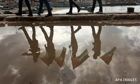 Supporters of Palestinian People's Party take part a protest demanding for reconstruction of the houses which were destroyed during the recent Israeli war, at the seaport near the coast of Gaza city, February 18, 2015. A...