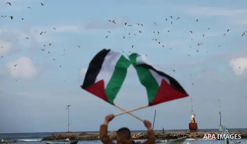 Supporters of Palestinian People's Party take part a protest demanding for reconstruction of the houses which were destroyed during the recent Israeli war, at the seaport near the coast of Gaza city, February 18, 2015. A...