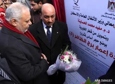 Palestinian housing minister Mufeed al-Hasayna participates in the corner stone ceremony for reconstruction of al-Zafer building, which was destroyed during the recent Israeli war on Gaza Strip, in Gaza city on February...