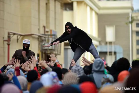 Egyptian students who are support ousted President Mohamed Morsi and the Muslim Brotherhood shout slogans during protest against the military rule, in Cairo University on February 18, 2015. Due to the escalation of stude...