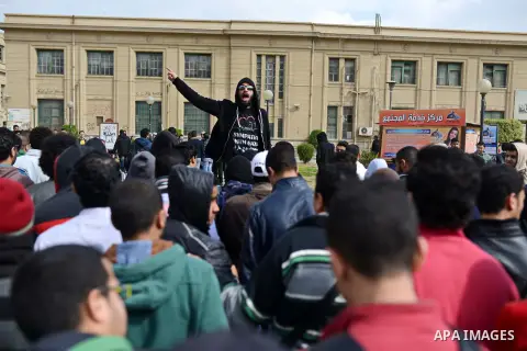 Egyptian students who are support ousted President Mohamed Morsi and the Muslim Brotherhood shout slogans during protest against the military rule, in Cairo University on February 18, 2015. Due to the escalation of stude...