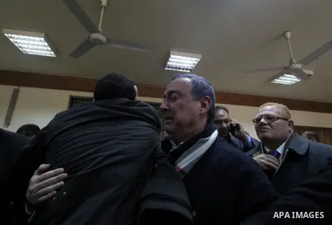 Former Egyptian oil minister Sameh Fahmy, reacts after a court overturned his conviction of selling cheap gas to Israel case at a court, in Cairo, Egypt, February 21, 2015. An Egyptian court acquitted former oil minister...